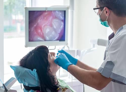 dental exam west allis | dentist and patient during exam