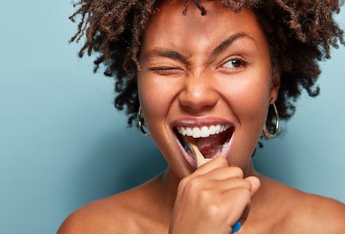 dental cleaning west allis | woman brushing teeth