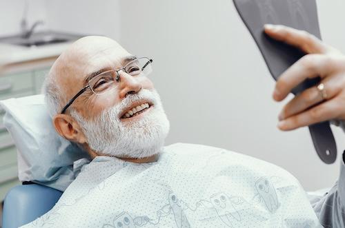 tooth extraction west allis | man at dentist