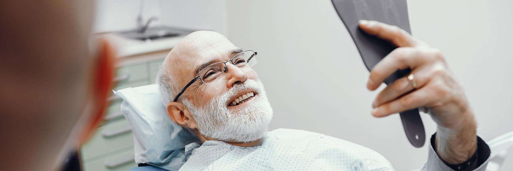 dental crowns milwaukee | man at dentist
