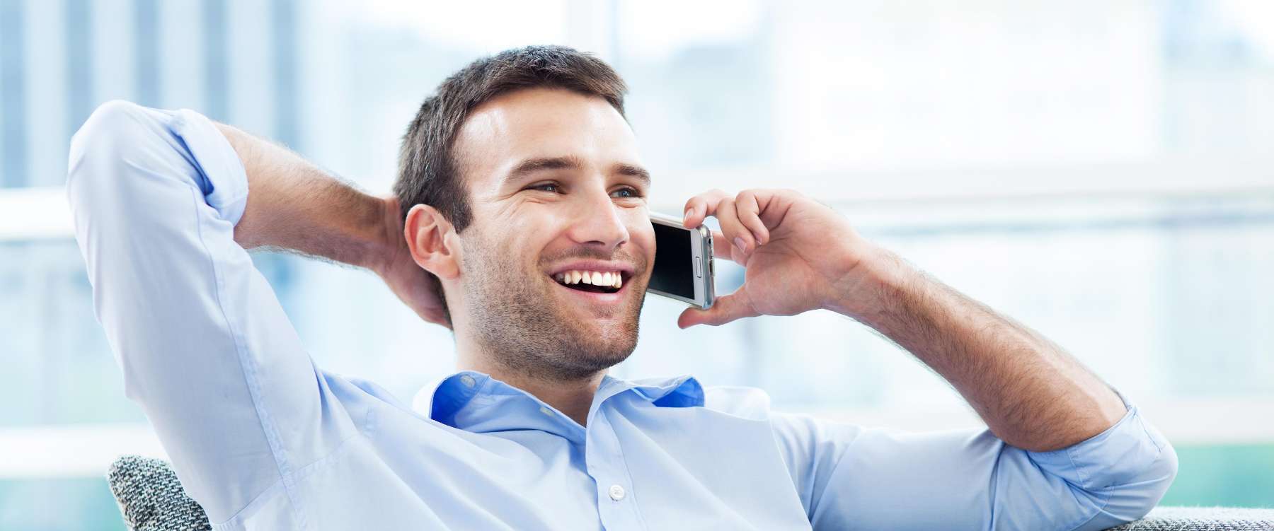 dentist milwaukee | man talking on phone