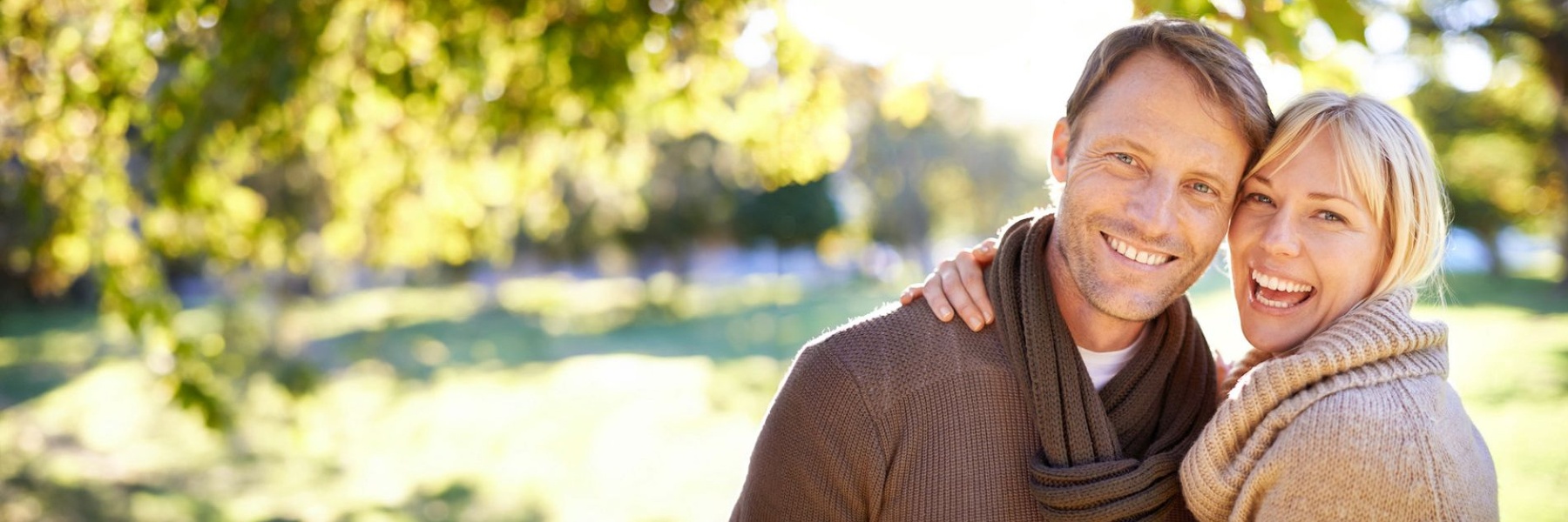 couple smiling at park near milwaukee, wi