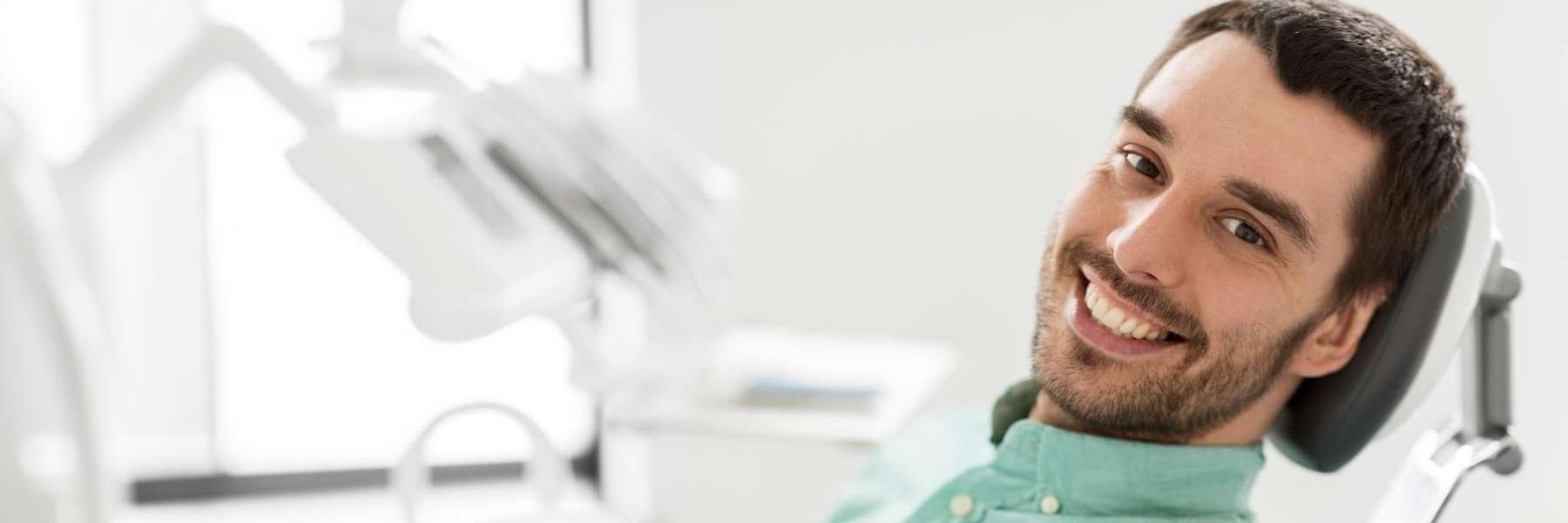 tooth extraction west allis | man at dentist